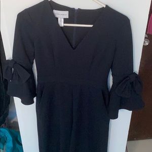 Navy long sleeve jumpsuit with bow sleeve